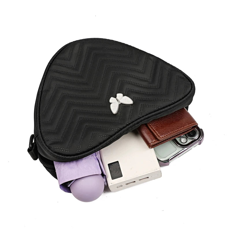 Neutral style shoulder bag for men and women, heart-shaped with butterfly-shaped decoration, suitable for travel.