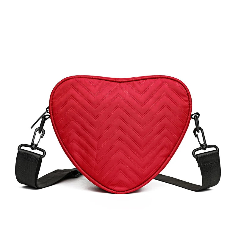 Neutral style shoulder bag for men and women, heart-shaped with butterfly-shaped decoration, suitable for travel.