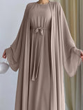 The simple and elegant Muslim robe, a two-piece outfit consisting of a vest and a wrap dress, includes a belt.