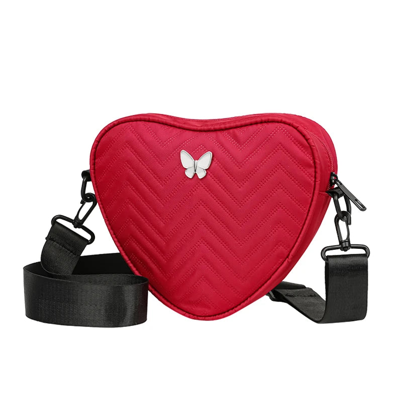 Neutral style shoulder bag for men and women, heart-shaped with butterfly-shaped decoration, suitable for travel.