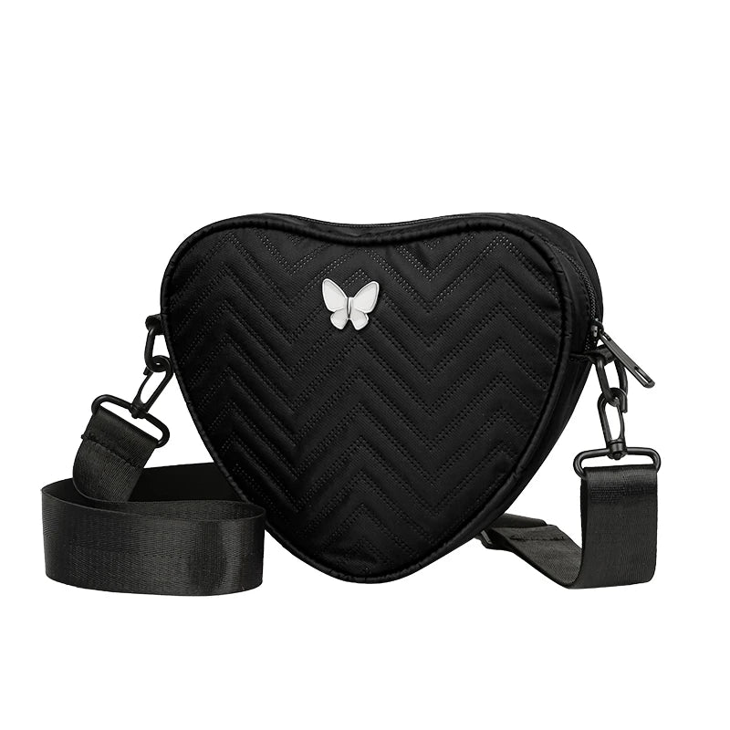 Neutral style shoulder bag for men and women, heart-shaped with butterfly-shaped decoration, suitable for travel.
